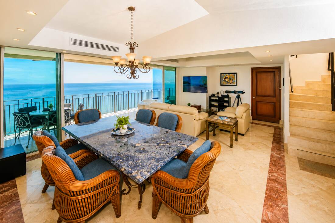 Dining room with granite table and ocean view