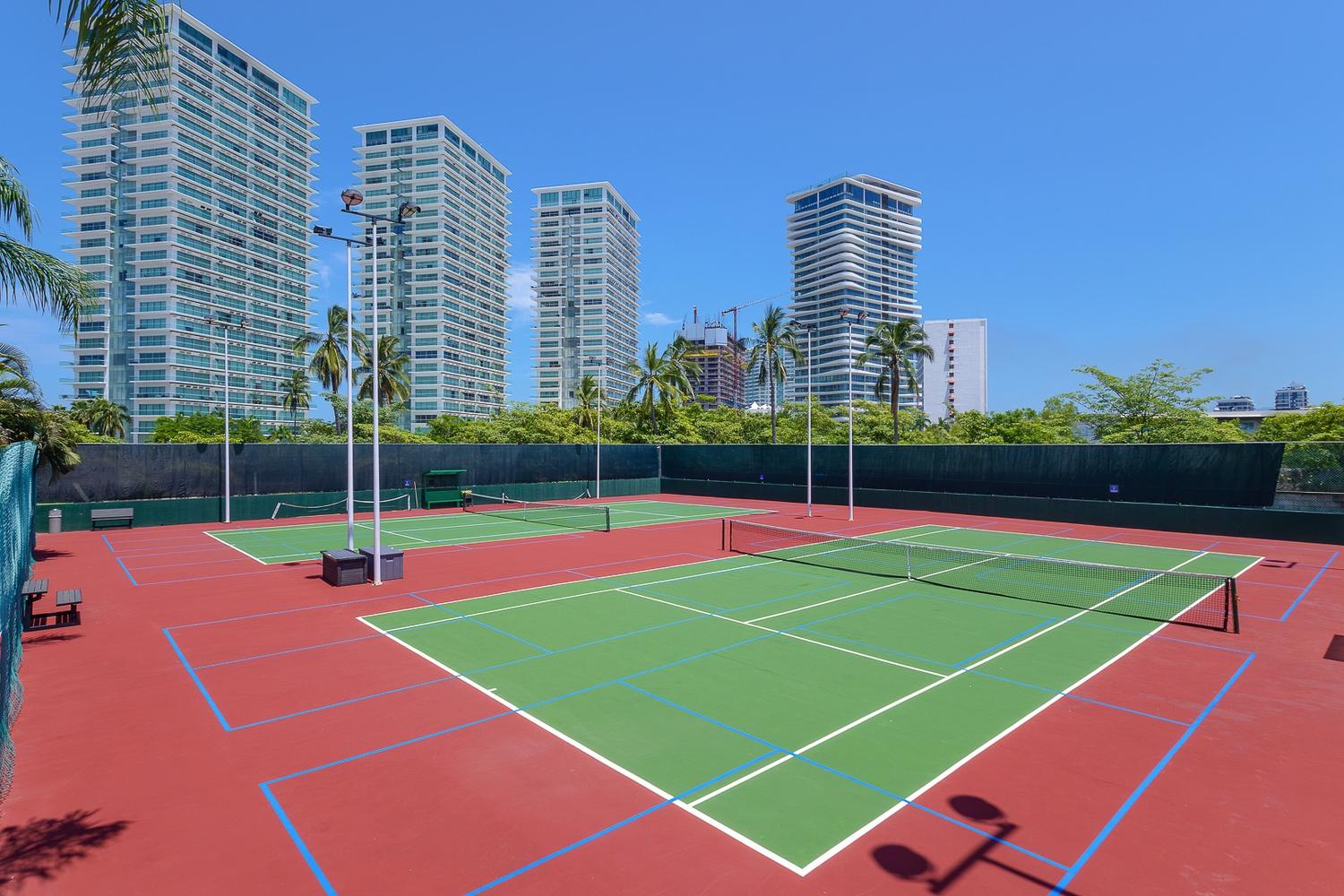 Tennis and multipurpose courts at Grand Venetian, with pickleball lines on the shared courts