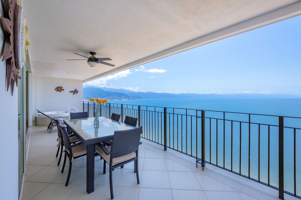 Terrace dining table overlooking Banderas Bay, Penthouse 2