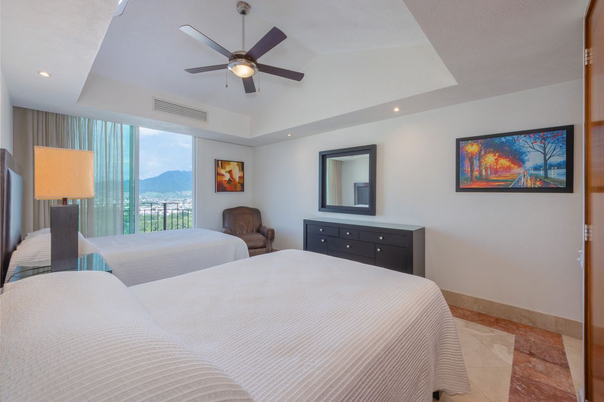 Bedroom suite with king bed and window seating, Penthouse 2