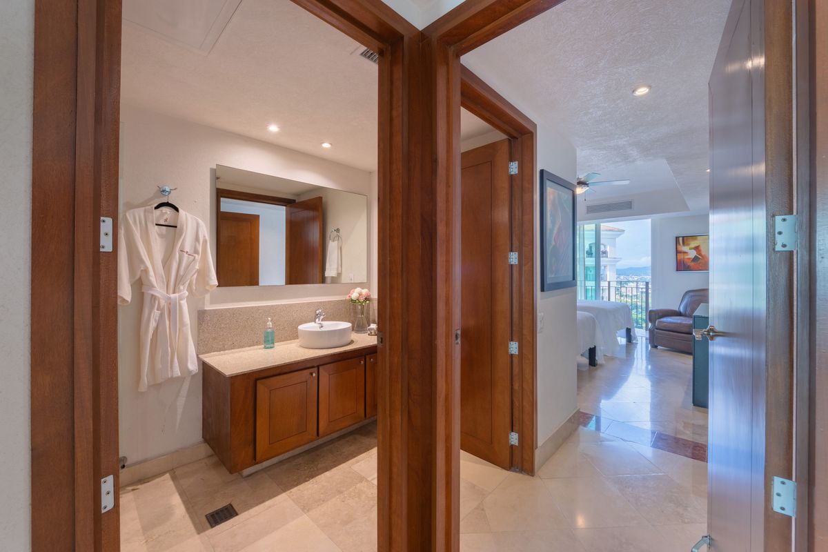 Guest bathroom vanity with robes, Penthouse 2