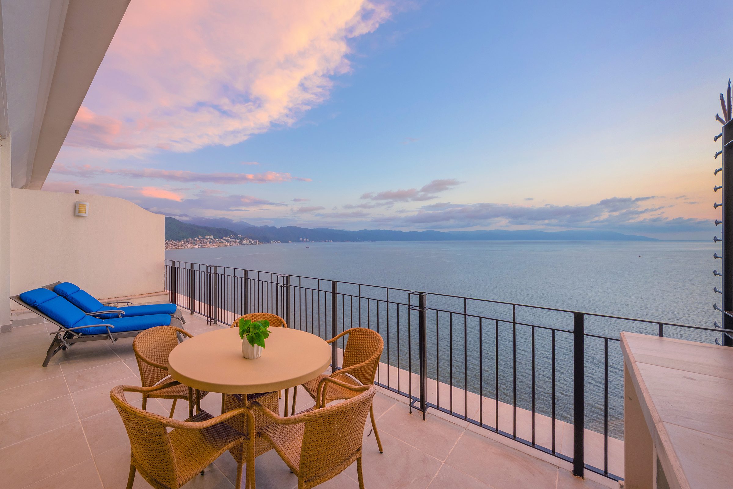 Terrace of Penthouse 2 at dusk, looking north along the coastline