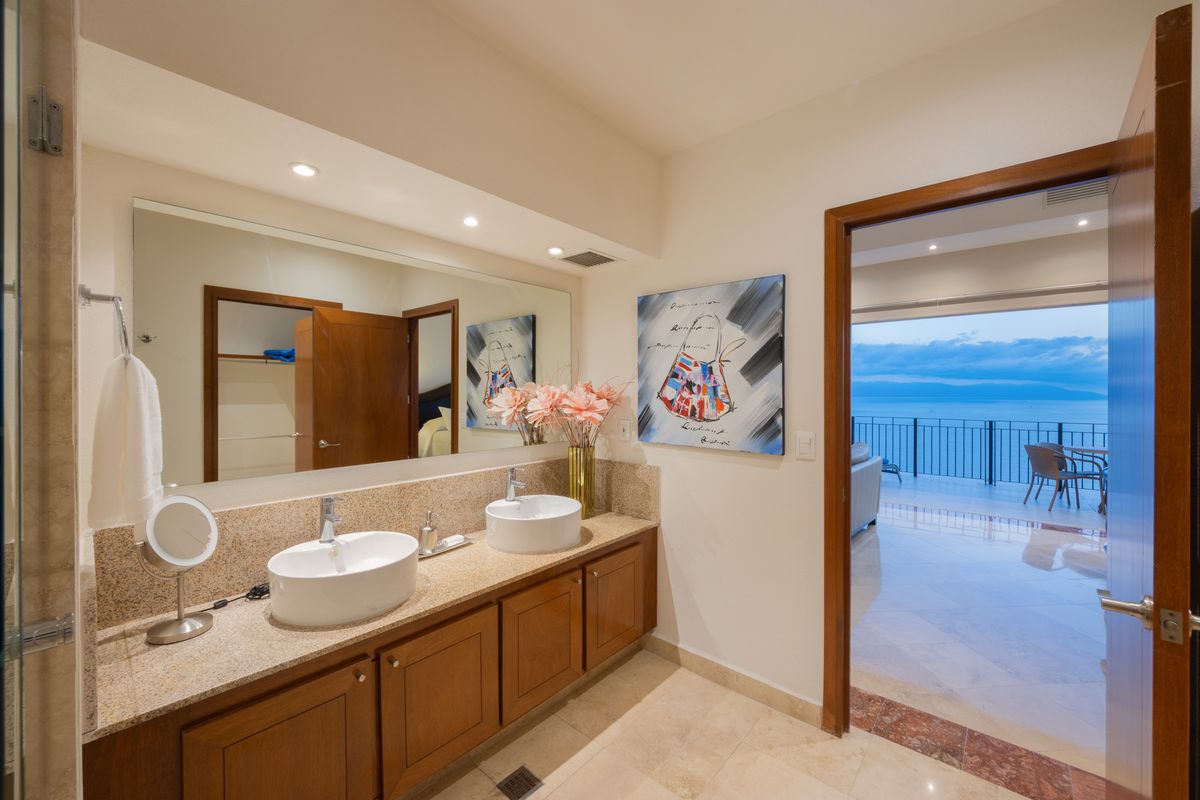 Bathroom vanity opening toward the terrace and ocean, Penthouse 2