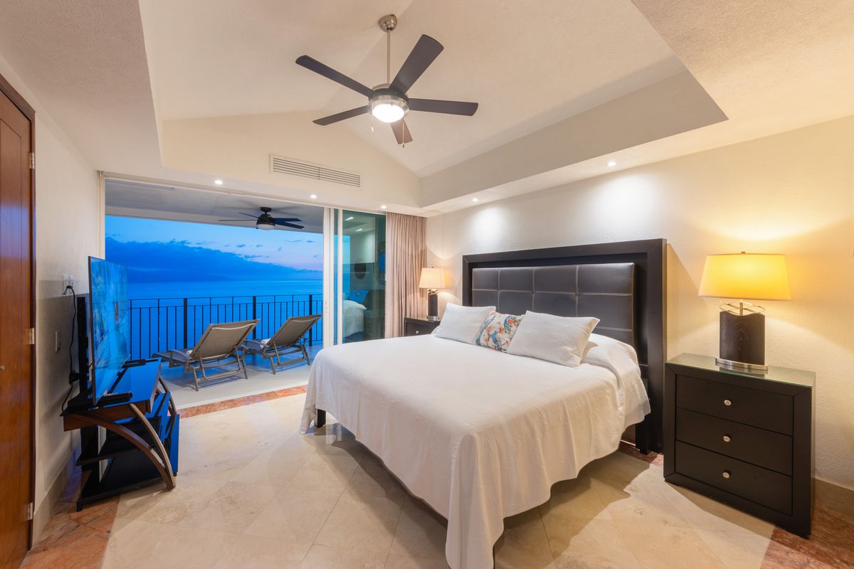 Bedroom at blue hour with the terrace beyond, Penthouse 2